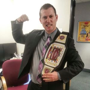 Corey Silver, Tournament Director for Hollywood Park Casino, with the Heavyweight belt to be awarded to the winner of the Championship Event.